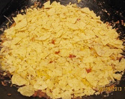 top the mexican casserole with crushed tortilla chips